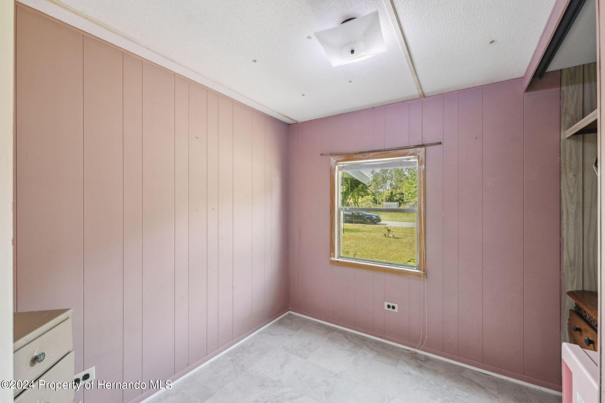 10327 East Victory Lane Inverness, FL 34450 - Photo 18 of 35 a view of an empty room with a window