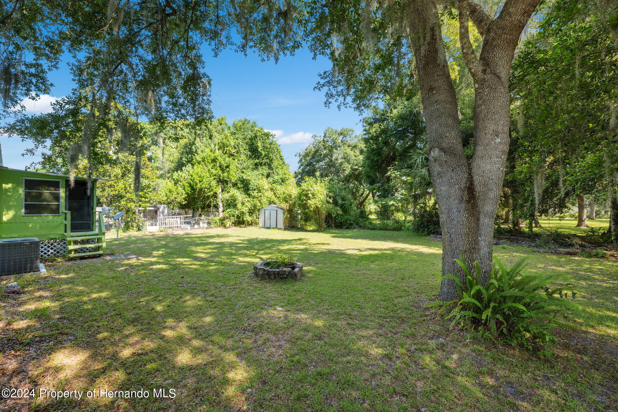 10327 East Victory Lane Inverness, FL 34450 - Photo 25 of 35 a view of backyard with green space