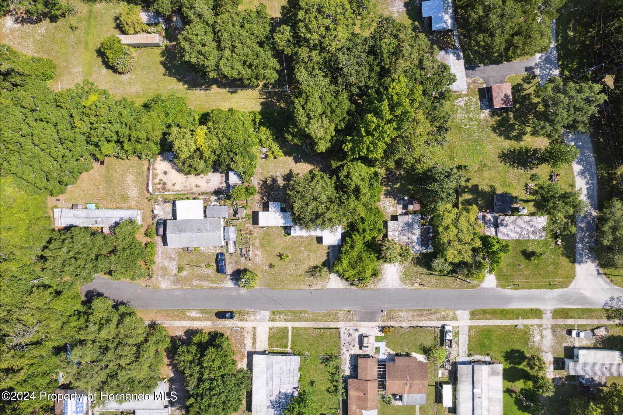 10327 East Victory Lane Inverness, FL 34450 - Photo 31 of 35 an aerial view of multiple houses with yard