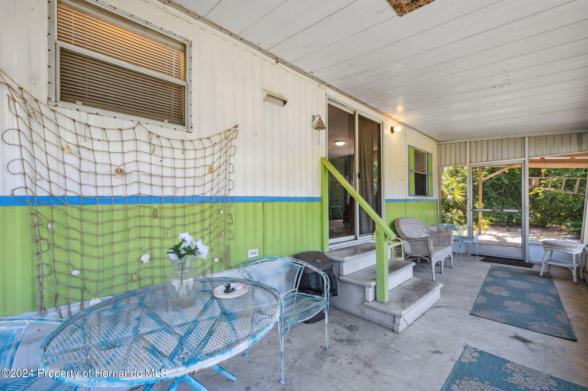 10327 East Victory Lane Inverness, FL 34450 - Photo 6 of 35 a swimming pool with outdoor seating