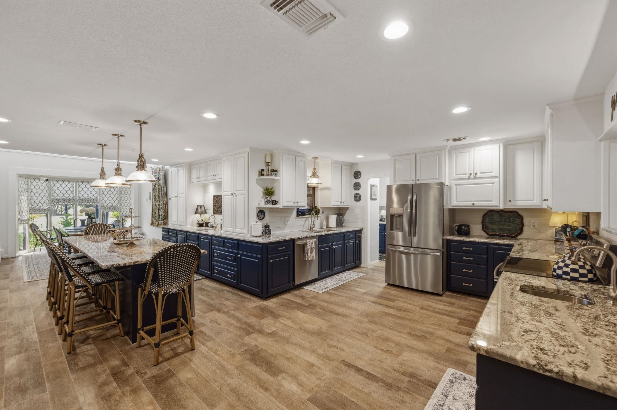 1435 East Zipp Road New Braunfels, TX 78130 - Photo 18 of 43 a large kitchen with a table and chairs