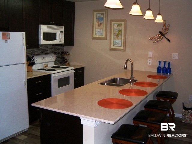 1517 Regency Road, Unit 11 Gulf Shores, AL 36542 - Photo 8 of 23 Upgraded Kitchen Cabinets & Quartz Counter Tops