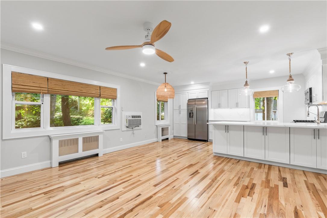 20 Chestnut Street, Unit 5 Rye, NY 10580 - Photo 1 of 1 a view of a kitchen with wooden floor and a window