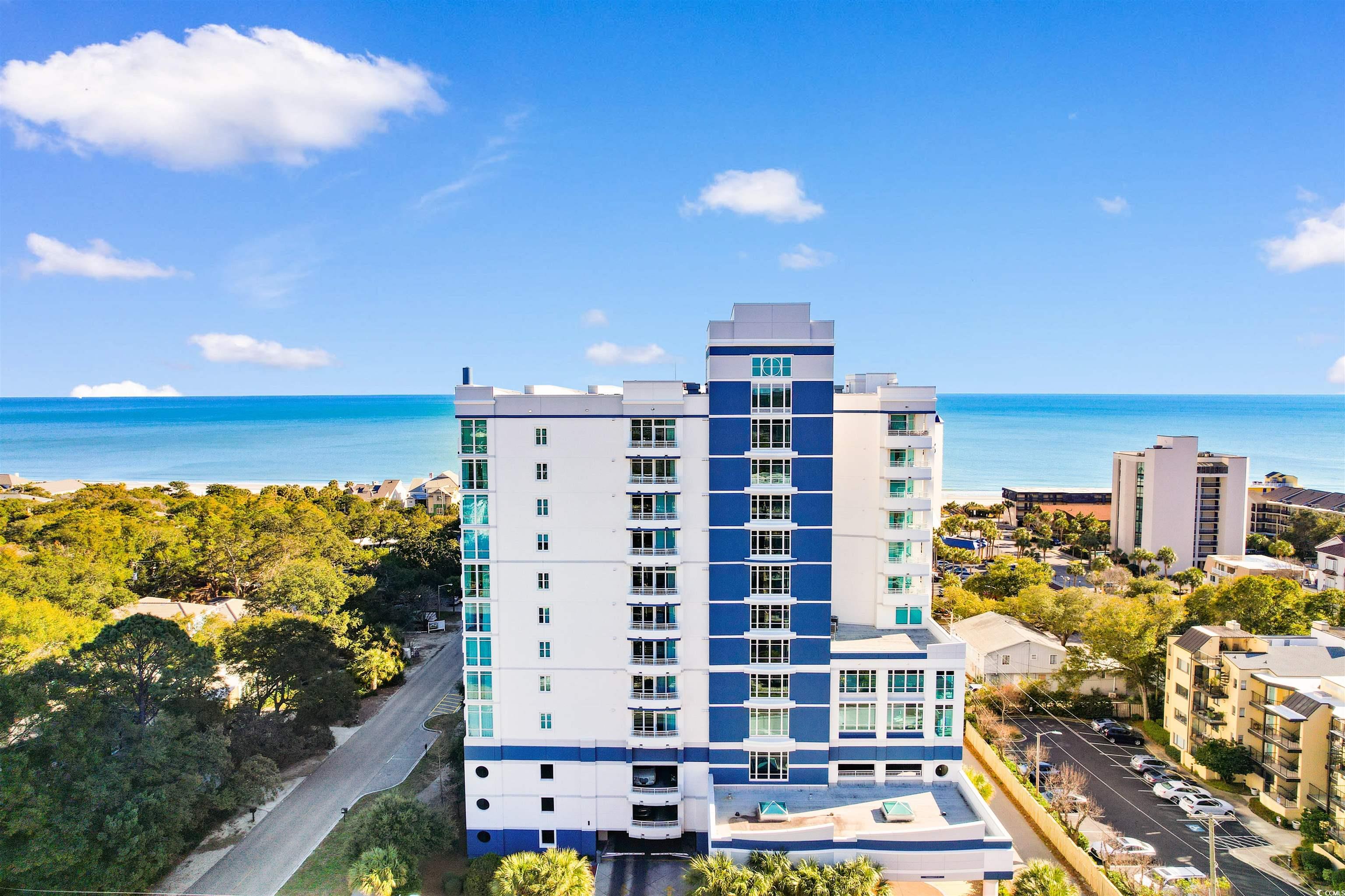 215 77th Avenue North, Unit 603 Myrtle Beach, SC 29572 - Photo 1 of 37 View of apartment building / complex featuring a water view