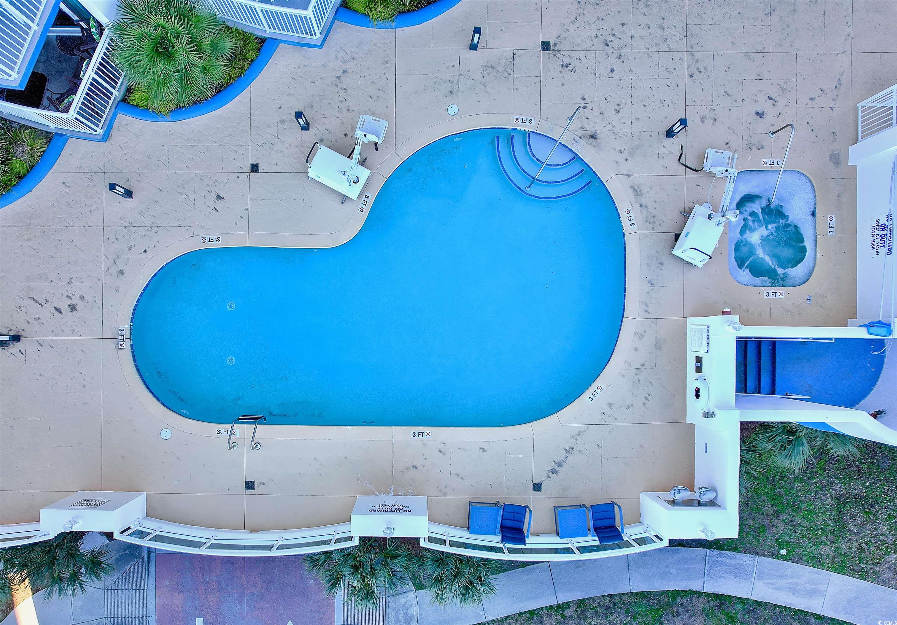 215 77th Avenue North, Unit 603 Myrtle Beach, SC 29572 - Photo 28 of 37 Drone / aerial view of a pool