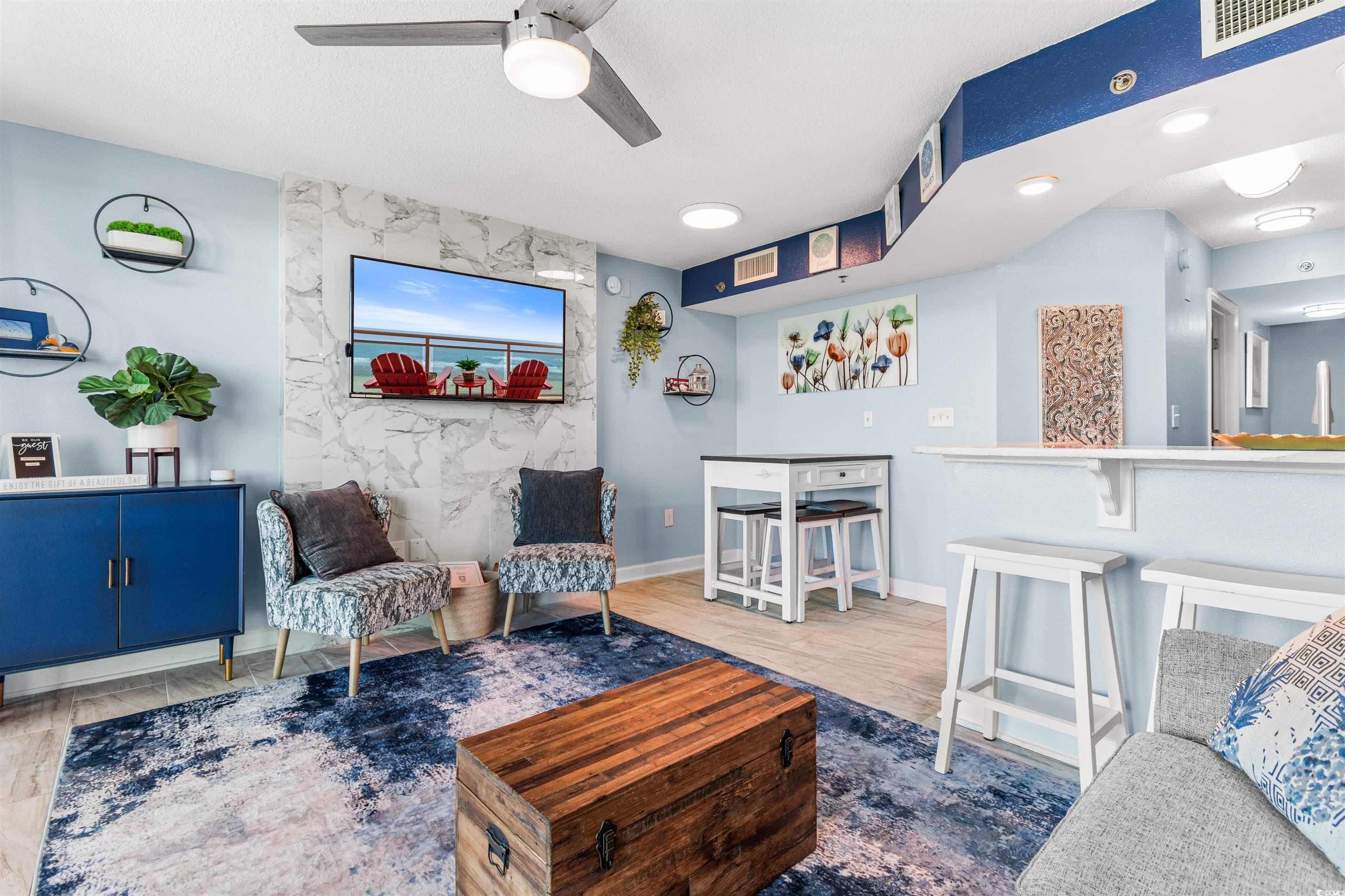 215 77th Avenue North, Unit 603 Myrtle Beach, SC 29572 - Photo 7 of 37 Living room with light wood-style flooring and ceiling fan