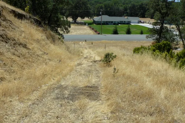 a view of house with yard