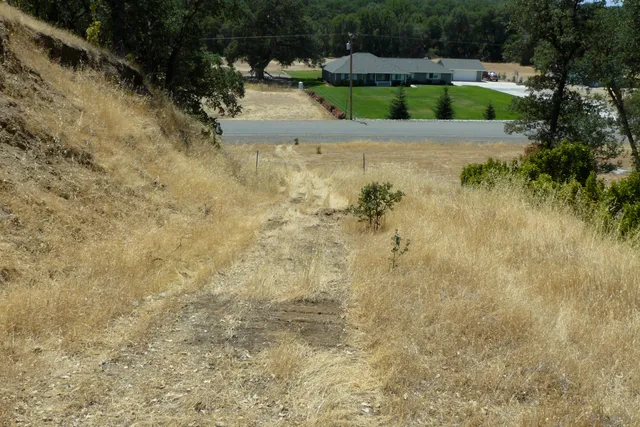 a view of house with yard