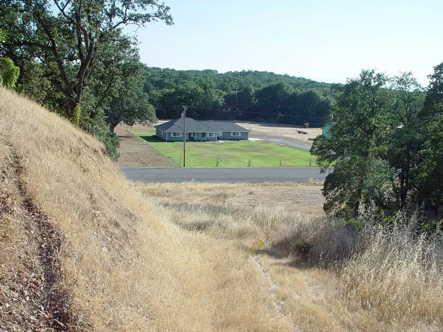a view of a swimming pool with a yard