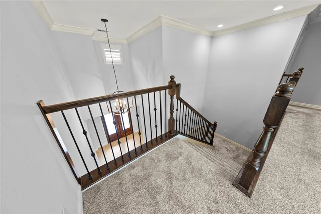 a view of a hallway with staircase