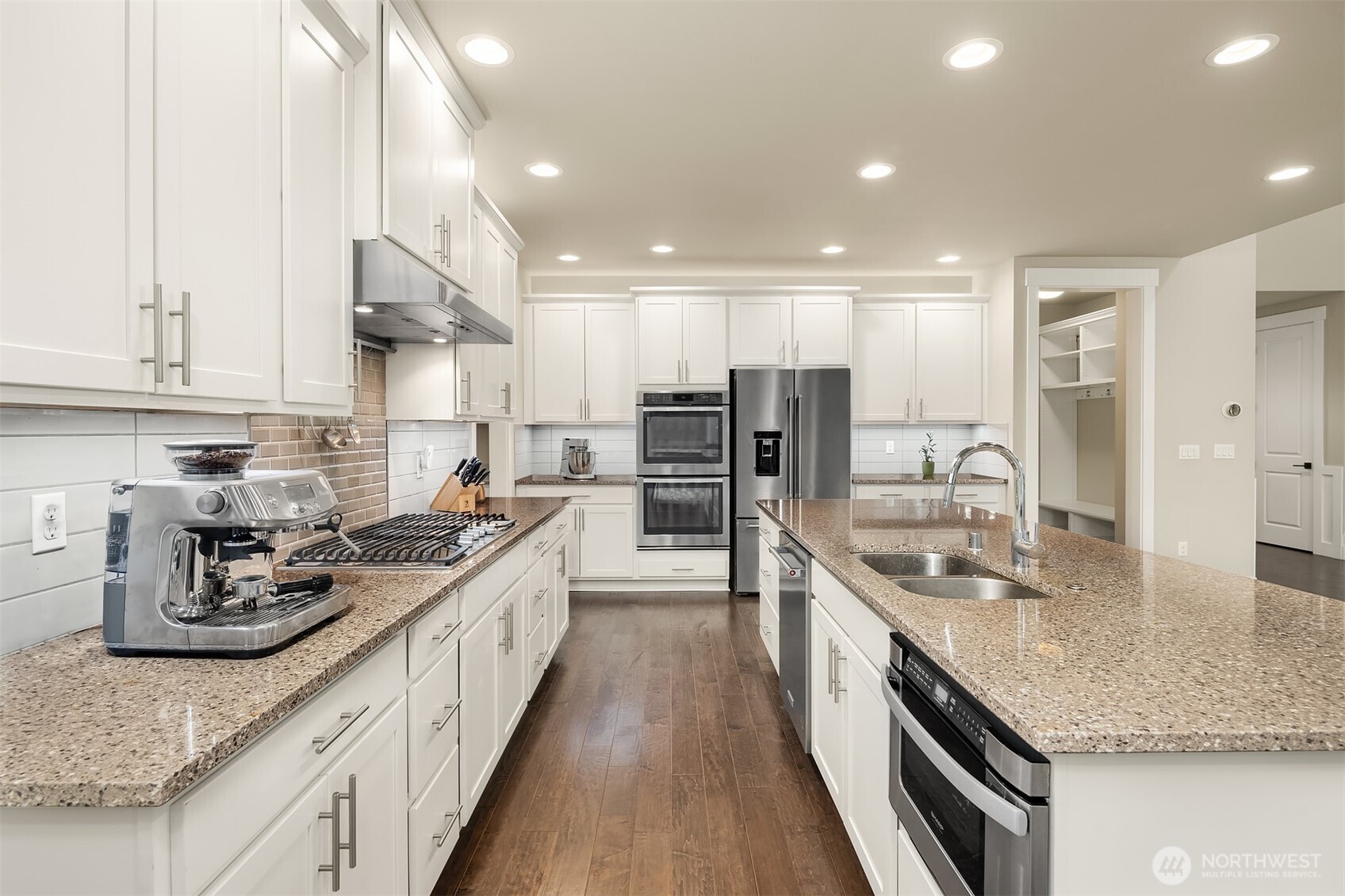 1435 242nd Place Southeast Bothell, WA 98021 - Photo 18 of 40 a large kitchen with stainless steel appliances granite countertop a lot of counter space and a sink