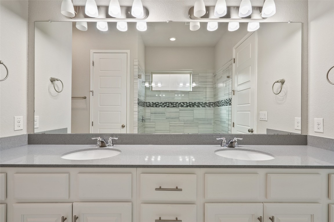 2909 Zelma Drive Cedar Park, TX 78613 - Photo 20 of 40 Full bathroom with a stall shower and double vanity