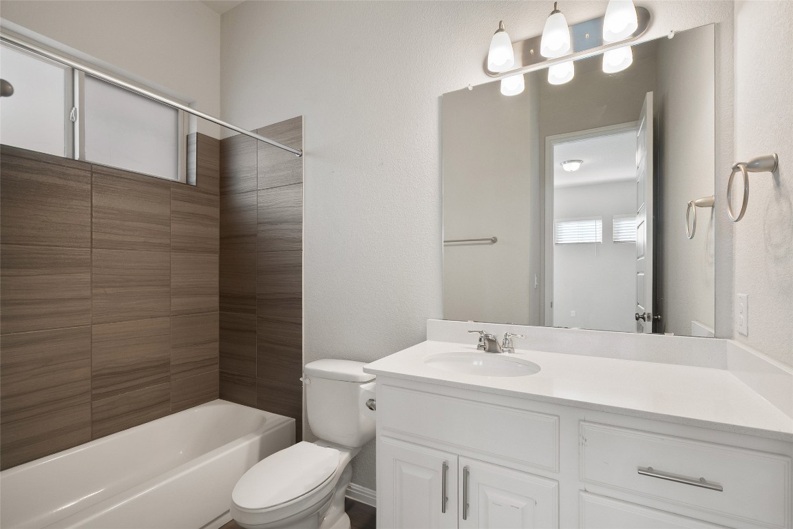 2909 Zelma Drive Cedar Park, TX 78613 - Photo 24 of 40 Full bathroom featuring vanity and washtub / shower combination