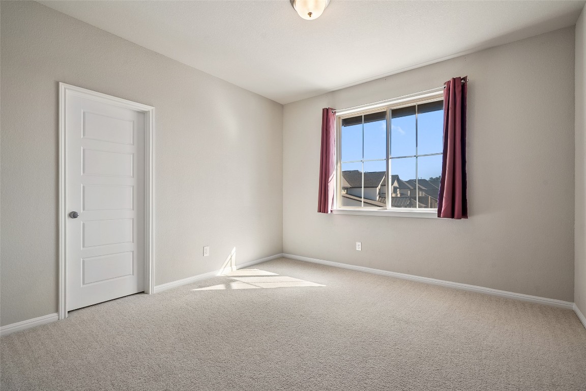 2909 Zelma Drive Cedar Park, TX 78613 - Photo 29 of 40 Carpeted empty room with baseboards