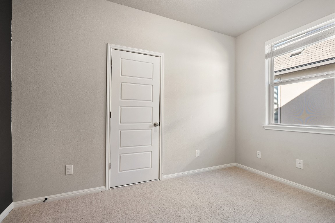 2909 Zelma Drive Cedar Park, TX 78613 - Photo 33 of 40 Carpeted spare room with baseboards