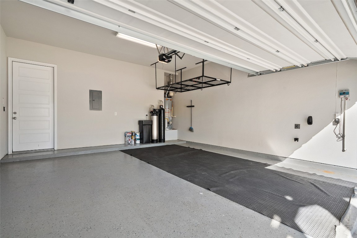 2909 Zelma Drive Cedar Park, TX 78613 - Photo 39 of 40 Garage with electric panel and gas water heater