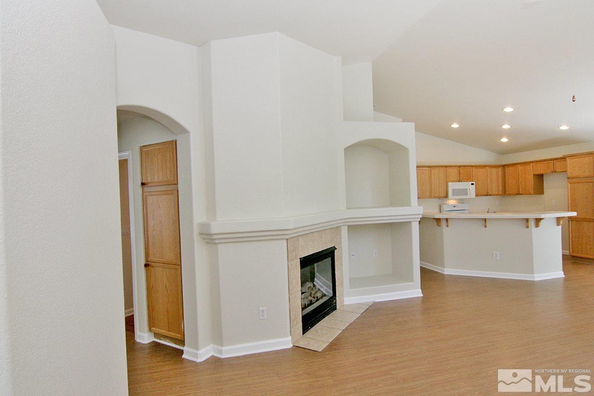 1880 Jamboree Drive Reno, NV 89521 - Photo 4 of 26 a view of a kitchen with a sink and a fireplace