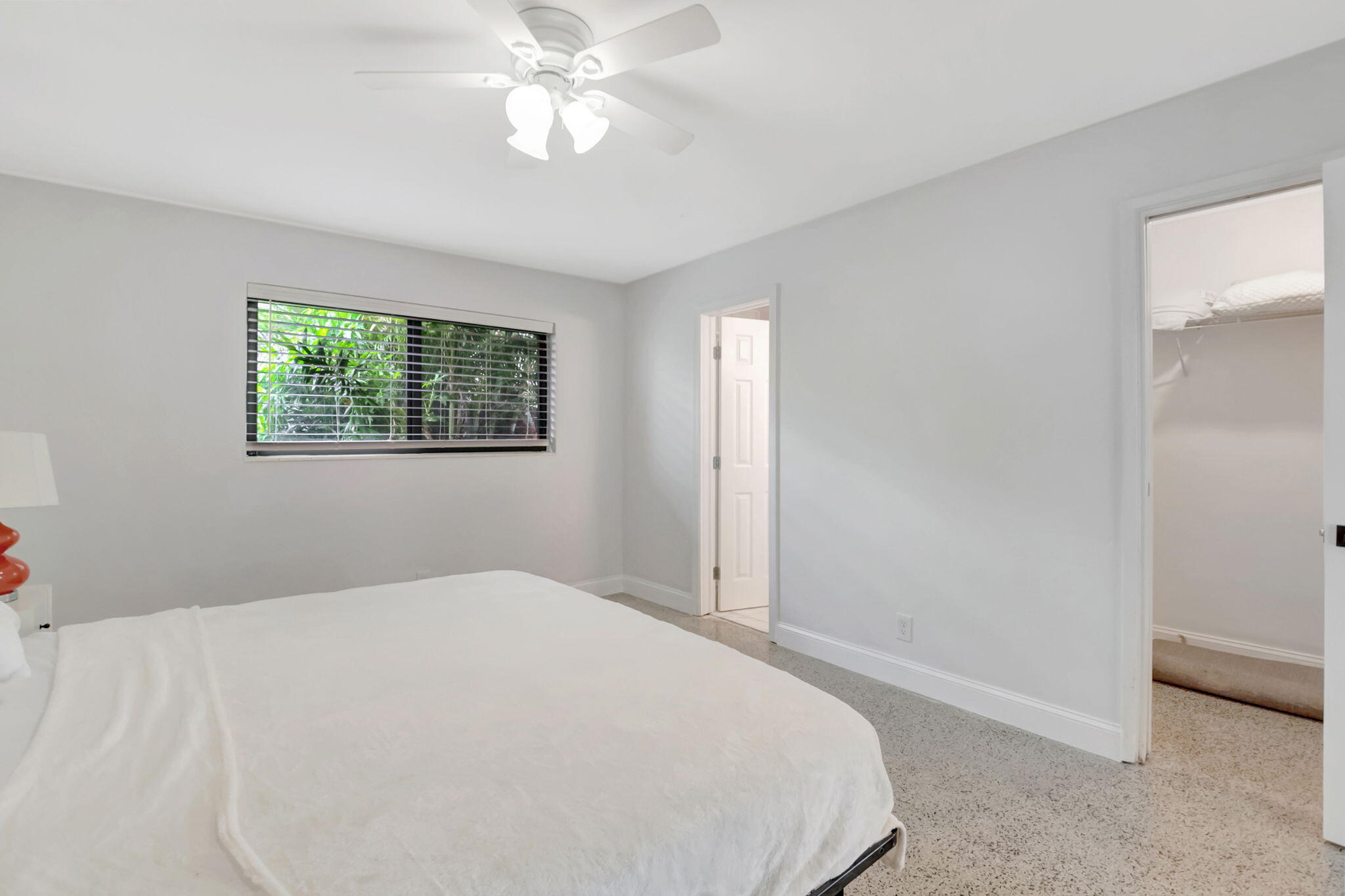 3550 Northeast 4th Avenue Boca Raton, FL 33431 - Photo 11 of 26 a bedroom with a large bed and a chandelier