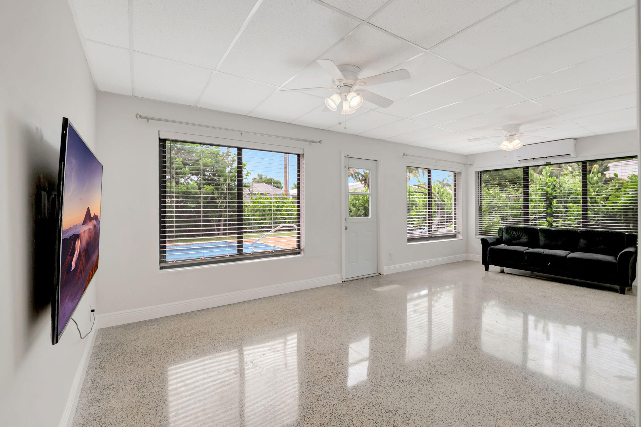 3550 Northeast 4th Avenue Boca Raton, FL 33431 - Photo 18 of 26 a view of an empty room with a window and wooden floor