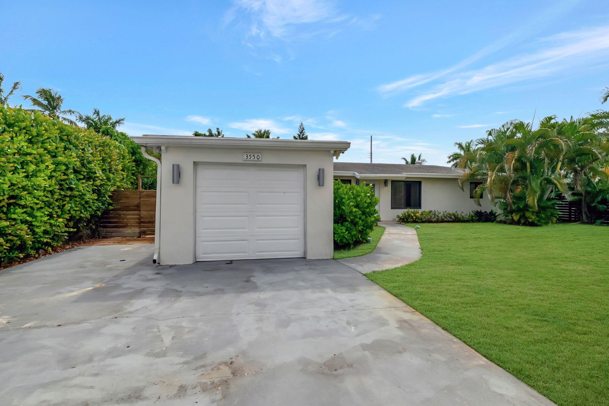 3550 Northeast 4th Avenue Boca Raton, FL 33431 - Photo 2 of 26 front view of a house with a yard