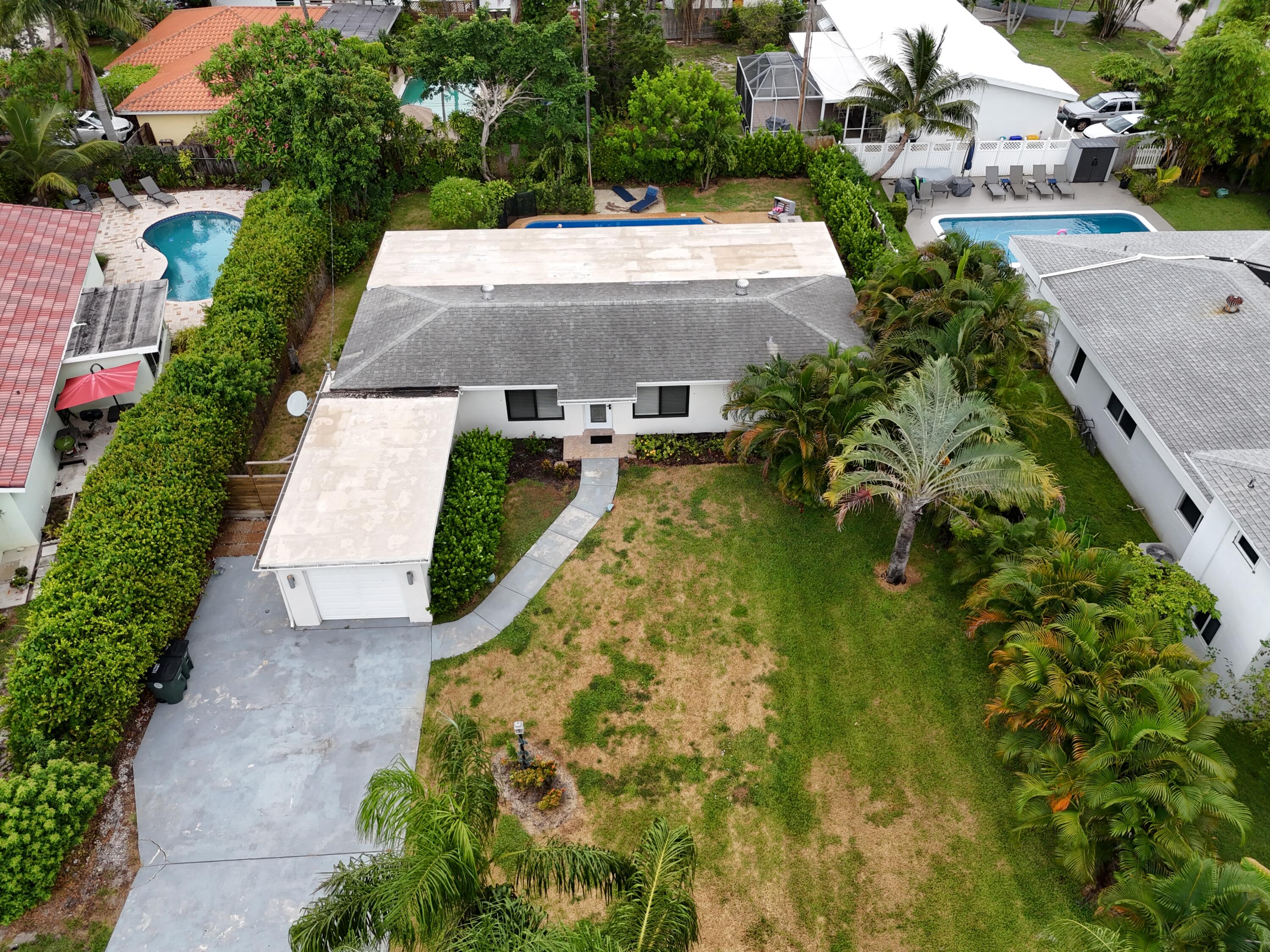 3550 Northeast 4th Avenue Boca Raton, FL 33431 - Photo 24 of 26 an aerial view of a house with a garden and swimming pool