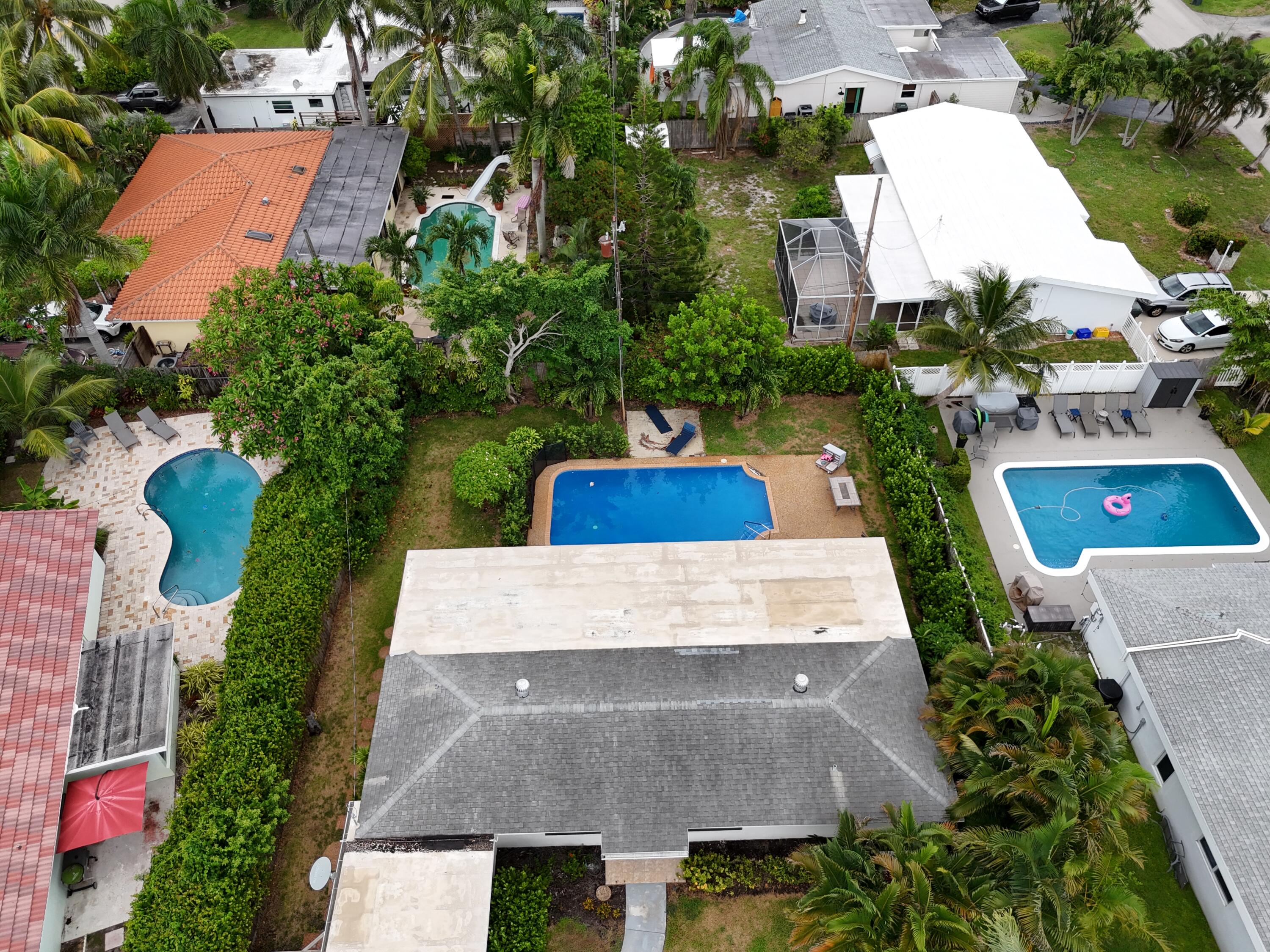 3550 Northeast 4th Avenue Boca Raton, FL 33431 - Photo 25 of 26 an aerial view of a house with a yard and large trees