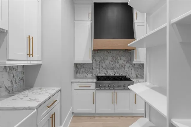 a view of an empty room with a fireplace