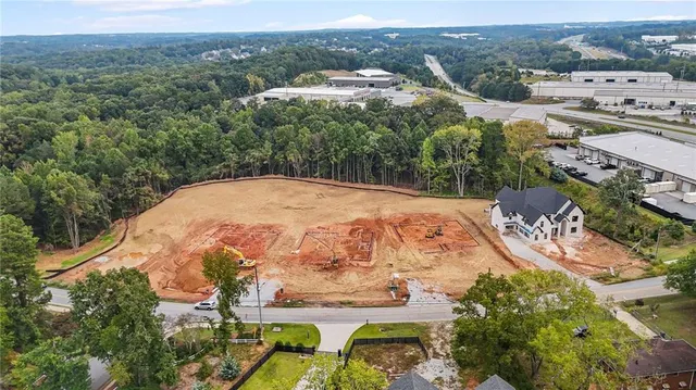 an aerial view of a residential houses and outdoor space
