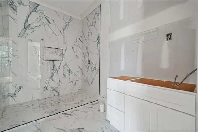 a bathroom with a shower and sink