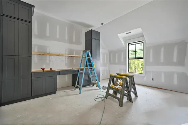a view of a livingroom with furniture and a window