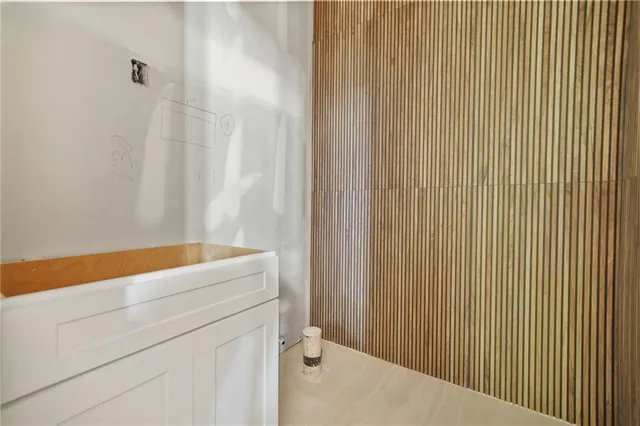 a balcony with furniture and a potted plant