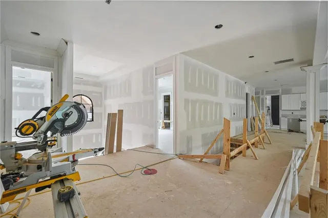a front view of a house with large windows