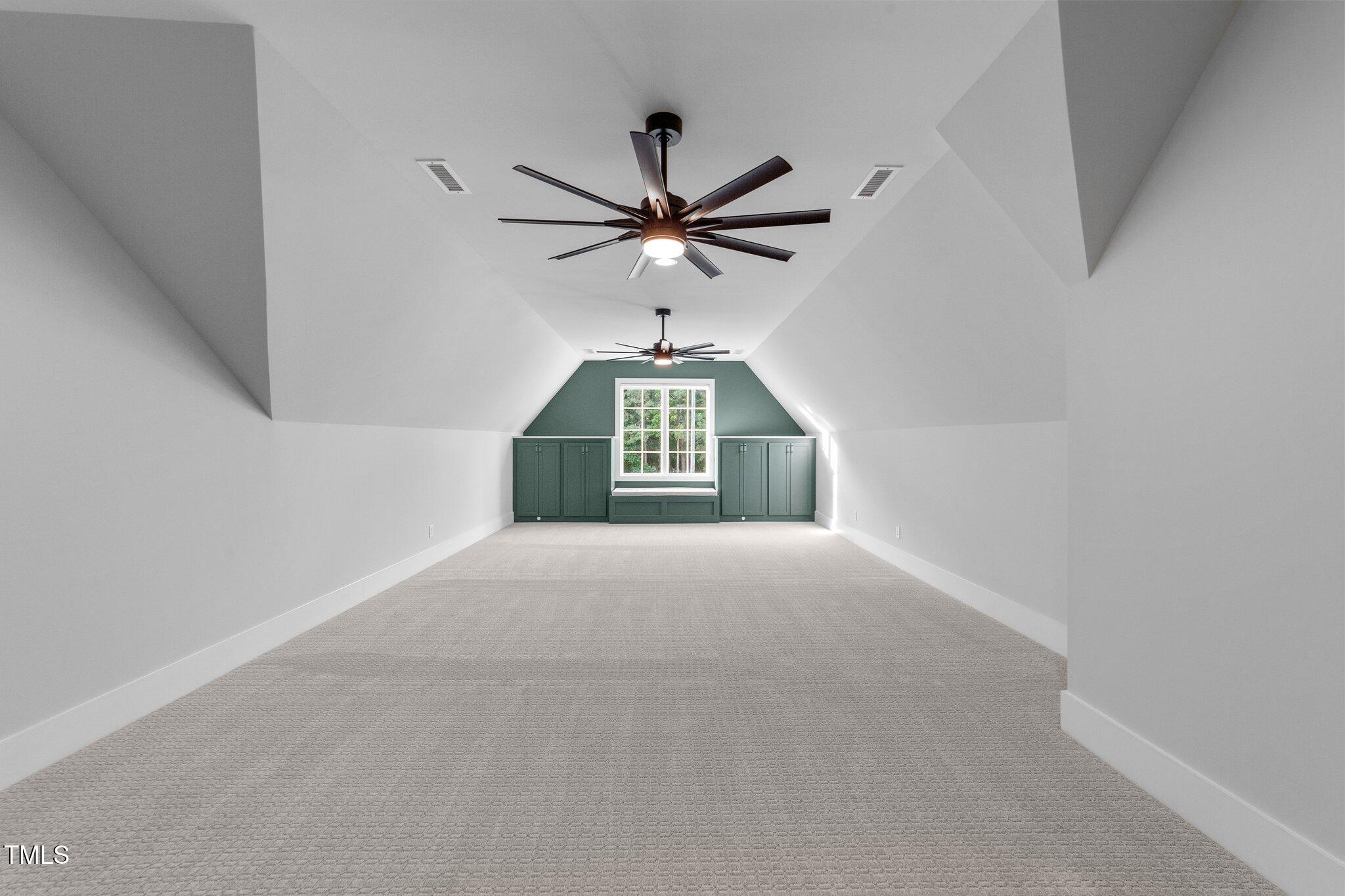 15517 Possum Track Road Raleigh, NC 27614 - Photo 43 of 66 a view of a room with a ceiling fan and a window