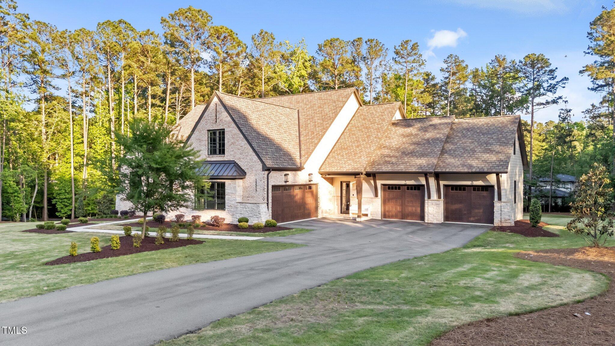 15517 Possum Track Road Raleigh, NC 27614 - Photo 61 of 66 a front view of house with yard and trees in the background