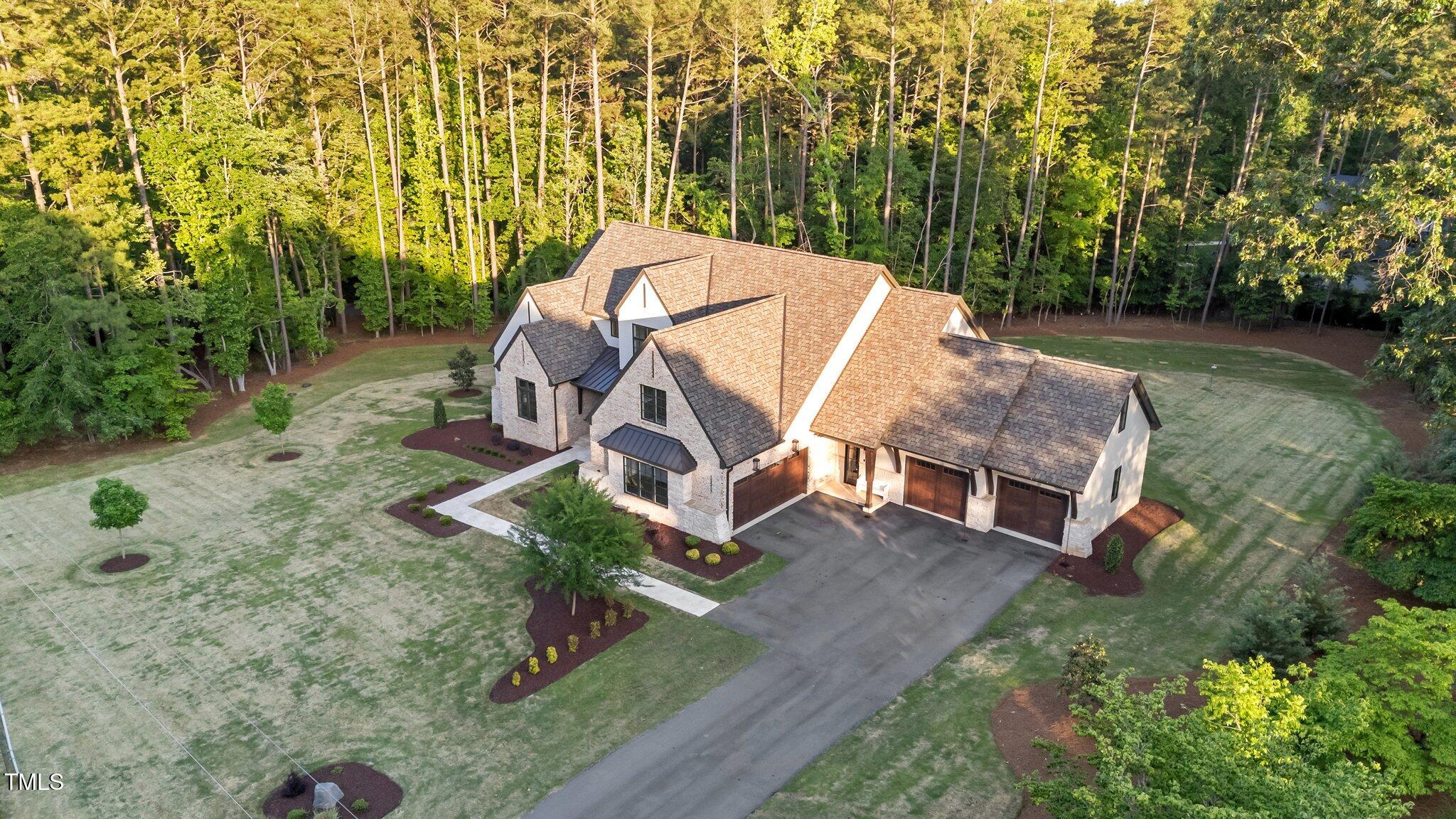 15517 Possum Track Road Raleigh, NC 27614 - Photo 62 of 66 an aerial view of a house with swimming pool and garden