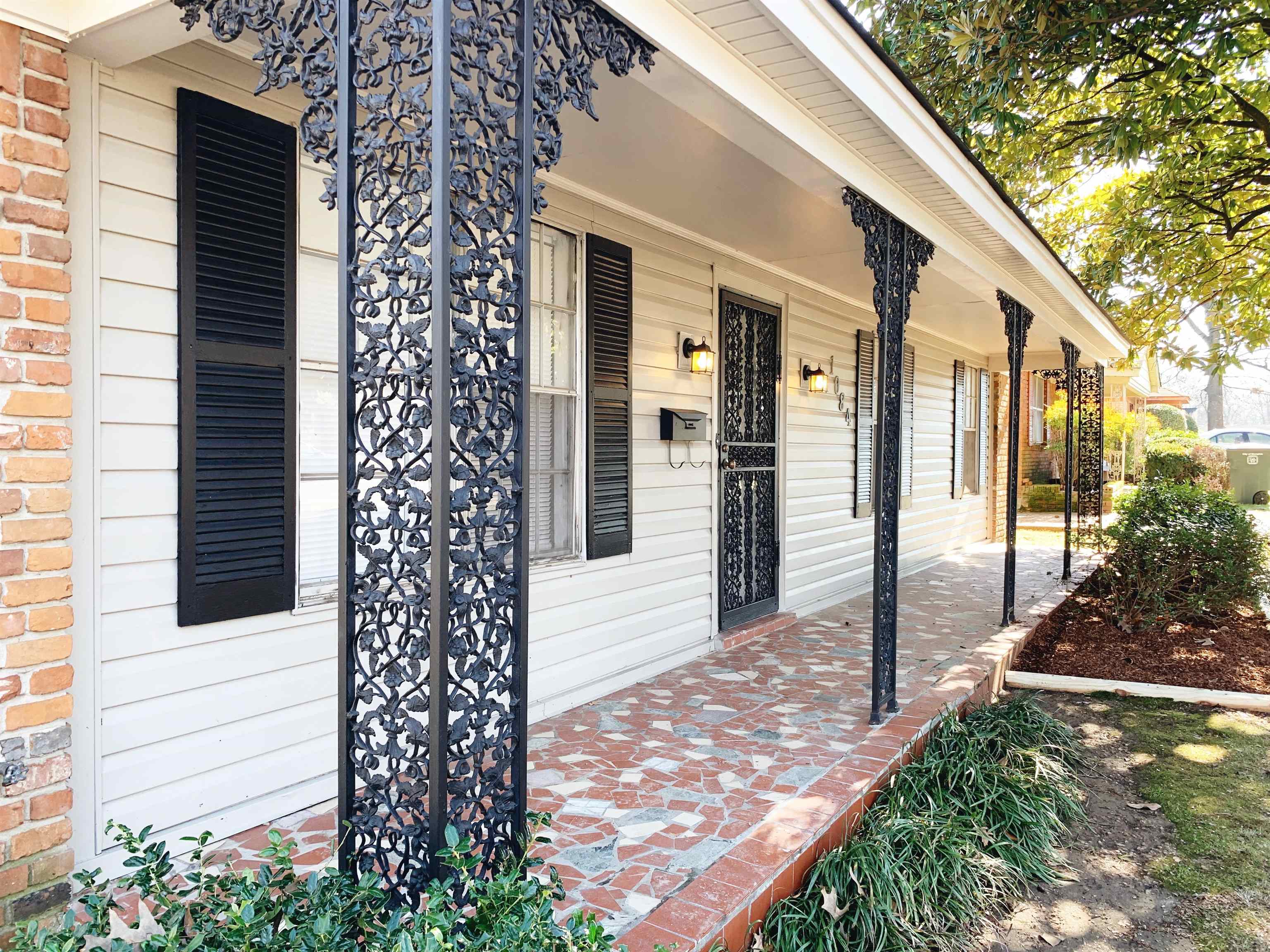 1084 Rutland Road Memphis, TN 38114 - Photo 13 of 13 a front view of a house with a yard