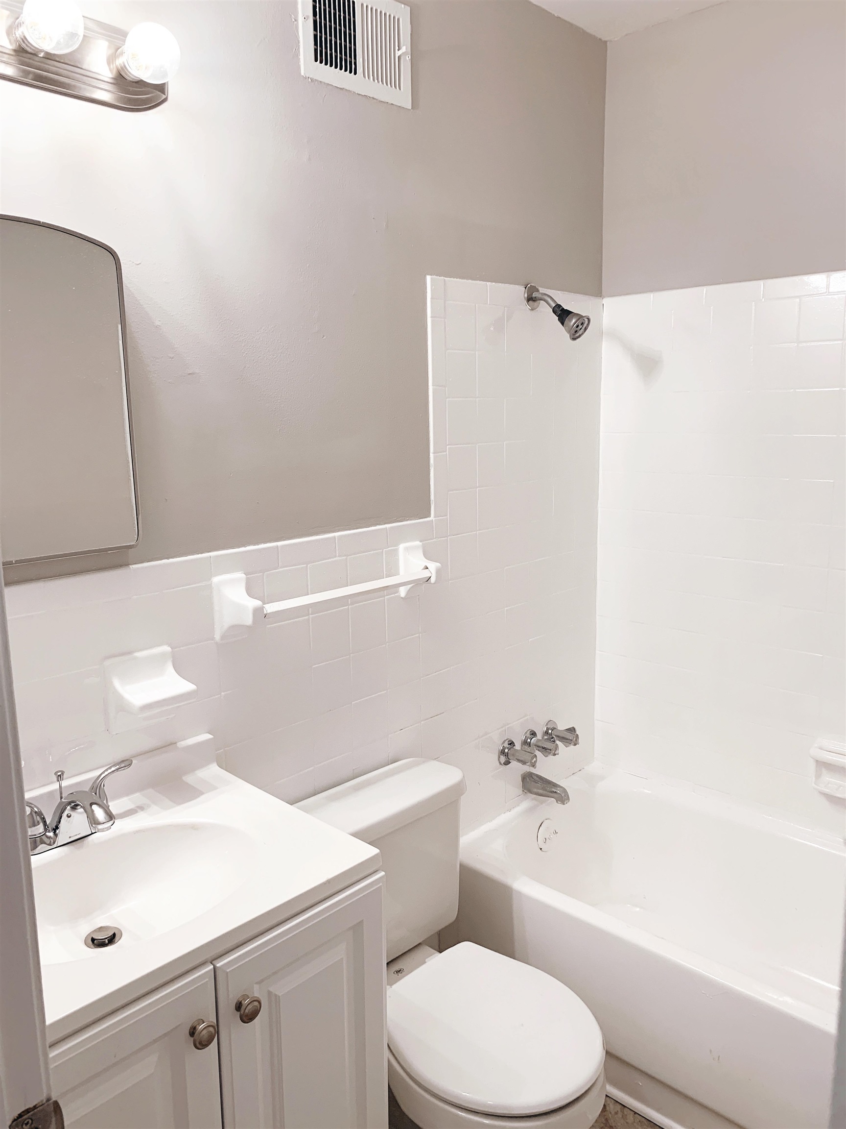 1084 Rutland Road Memphis, TN 38114 - Photo 3 of 13 a bathroom with a sink a toilet and shower