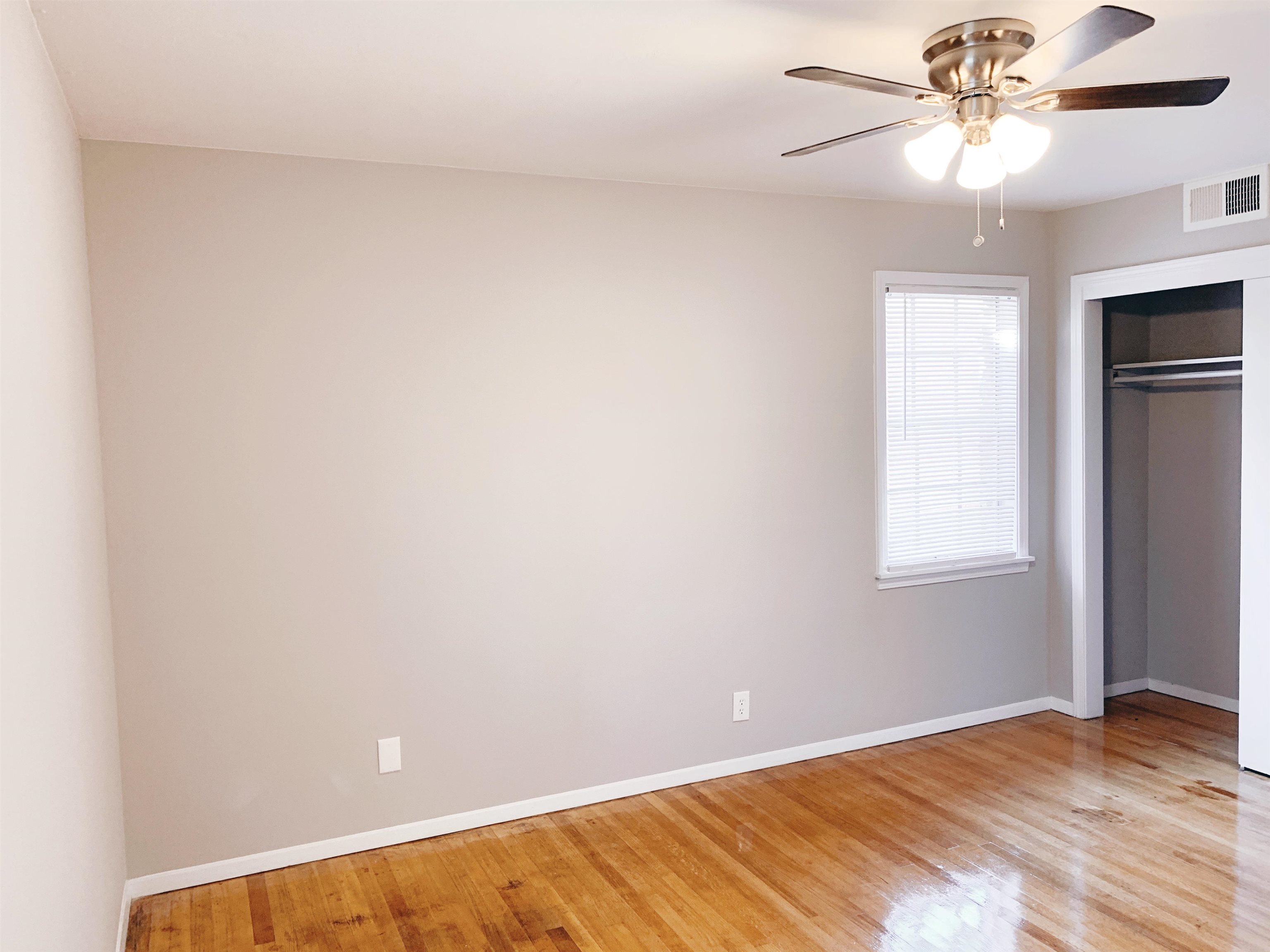 1084 Rutland Road Memphis, TN 38114 - Photo 5 of 13 a view of an empty room with a window