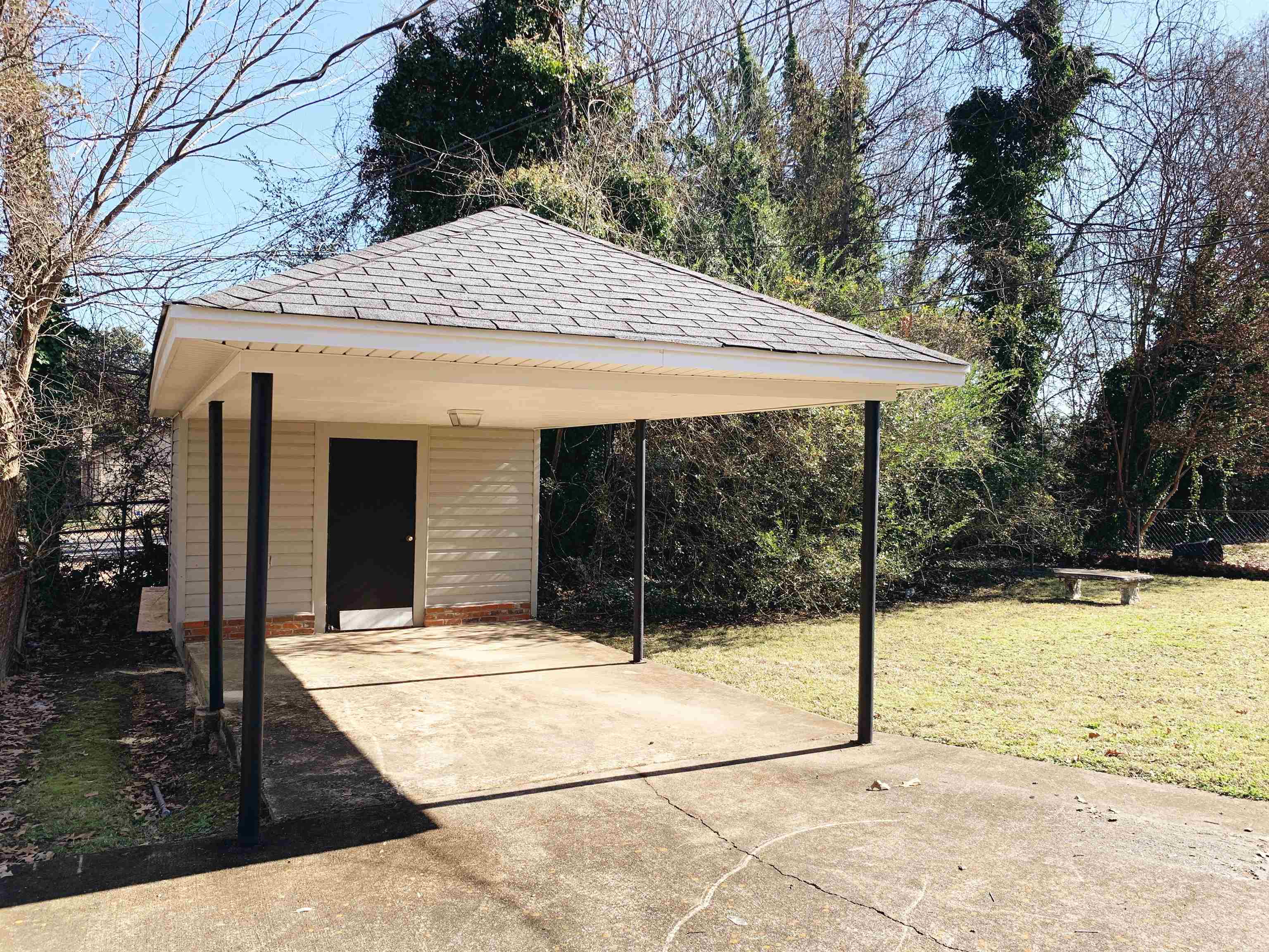 1084 Rutland Road Memphis, TN 38114 - Photo 7 of 13 a backyard of a house with basket ball court