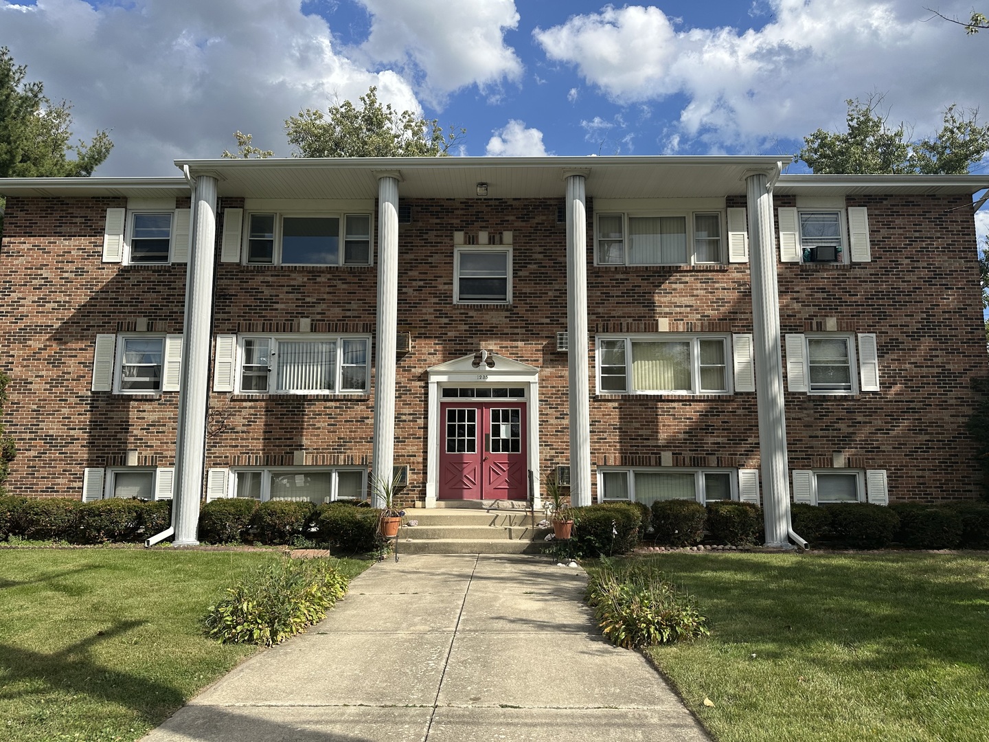 1235 Columbia Street, Unit 5 Crete, IL 60417 - Photo 1 of 13 front view of a house with a yard