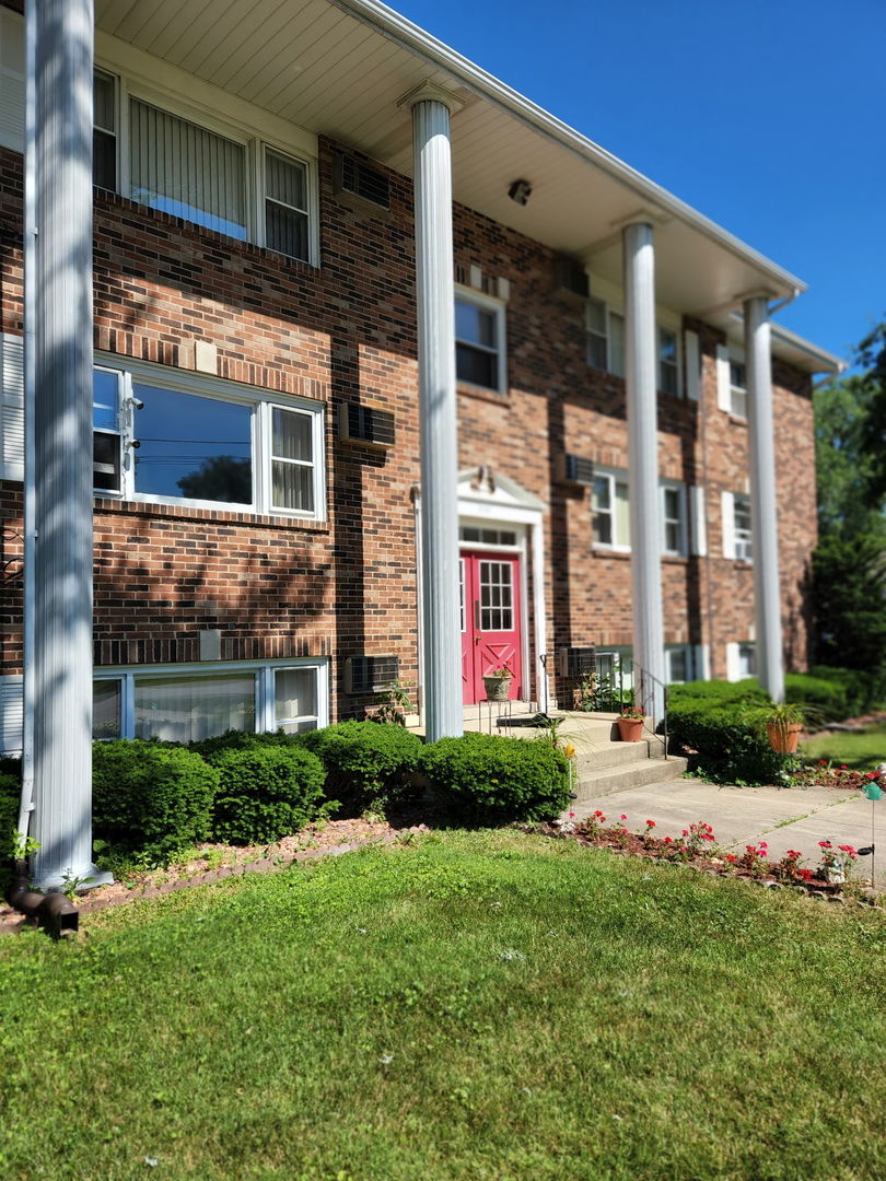 1235 Columbia Street, Unit 5 Crete, IL 60417 - Photo 12 of 13 a front view of a house with a yard