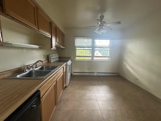 a kitchen that has a sink and a stove