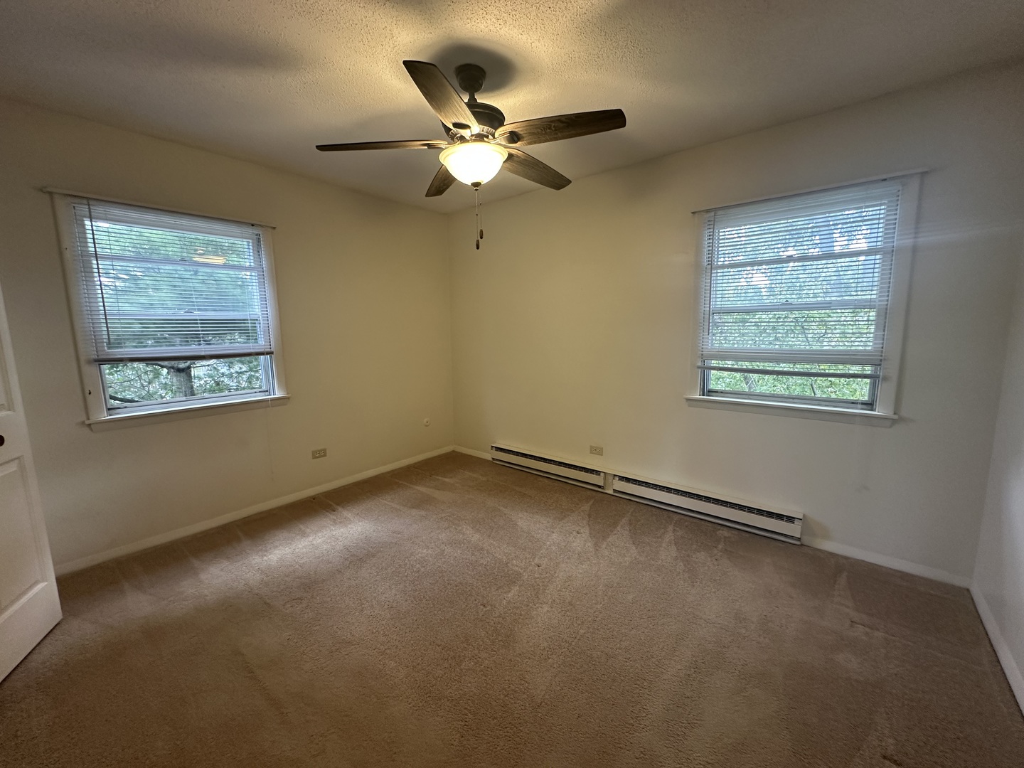 1235 Columbia Street, Unit 5 Crete, IL 60417 - Photo 4 of 13 a view of an empty room with a window