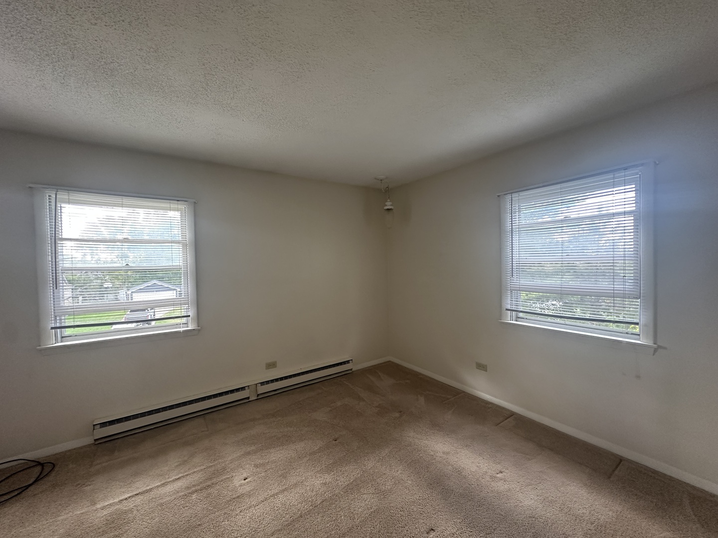 1235 Columbia Street, Unit 5 Crete, IL 60417 - Photo 5 of 13 an empty room with a window