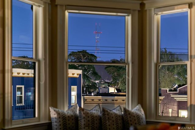 a living room filled with furniture and a window