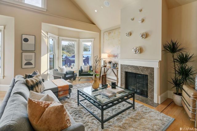 a bedroom with a bed and a potted plant