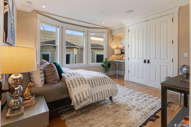 a view of a roof deck with couches and potted plants