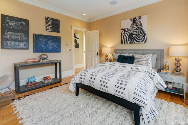 a roof deck with couches and potted plants