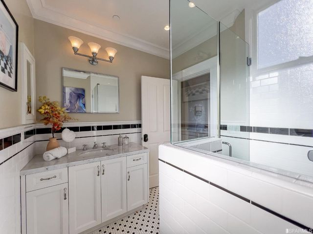 a front view of a residential apartment building with a yard