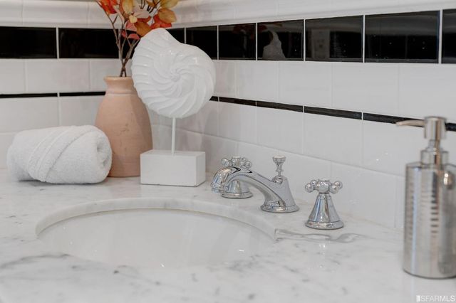 a front view of a residential apartment building with a yard